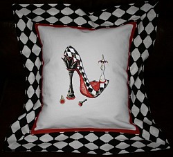 Machine embroidered Checkmate Shoe on cushion.